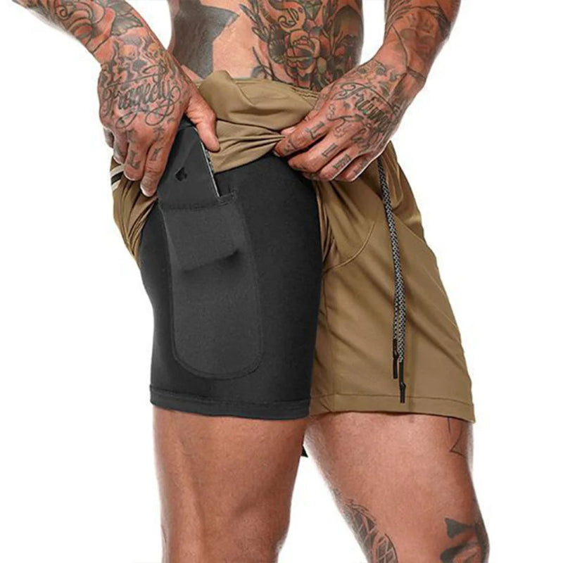 Person wearing a black and beige athletic outfit with visible tattoos on arms and legs.