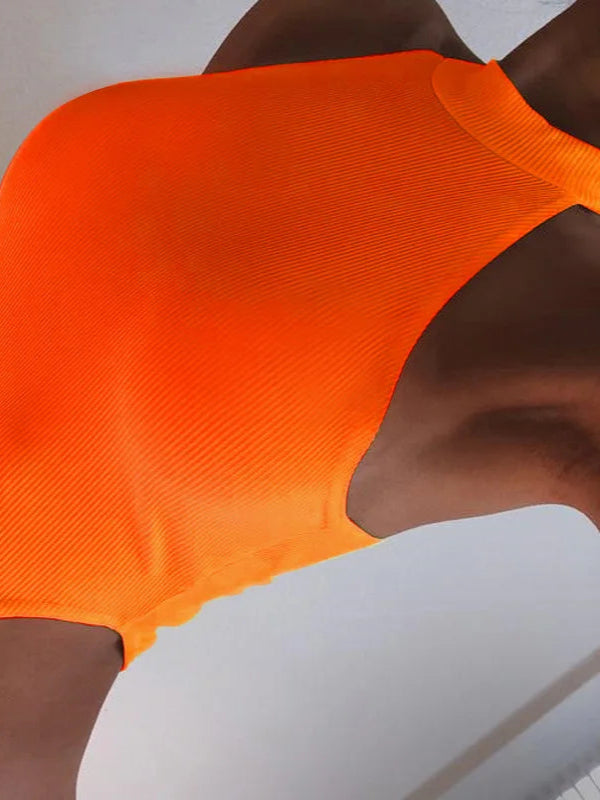 Close-up of an orange swimsuit on a neutral background