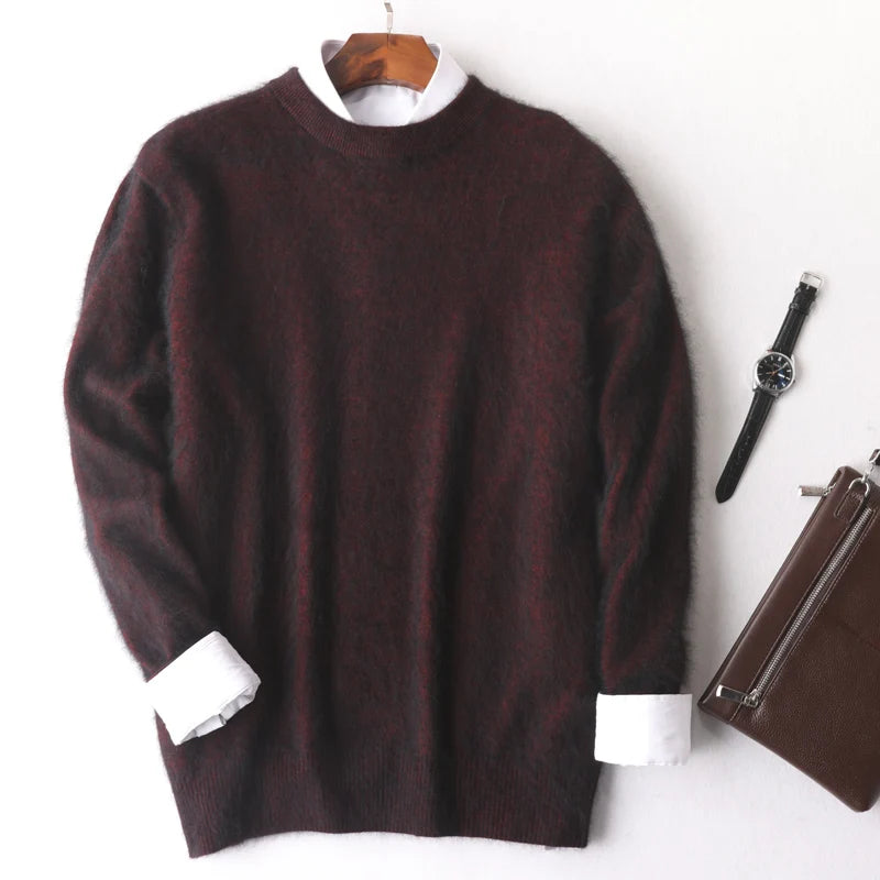 Brown sweater with white cuffs on a hanger, next to a watch and brown bag on a white background