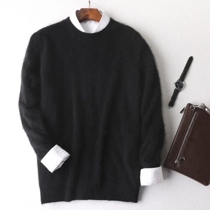 Black sweater with white cuffs and collar on a hanger, next to a brown leather bag and black watch on a white background