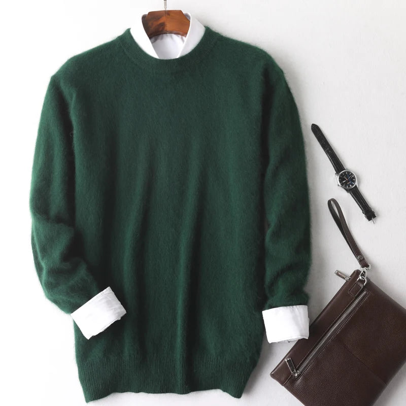 Green sweater with white cuffs and collar on a hanger, next to a watch and brown bag on a white background