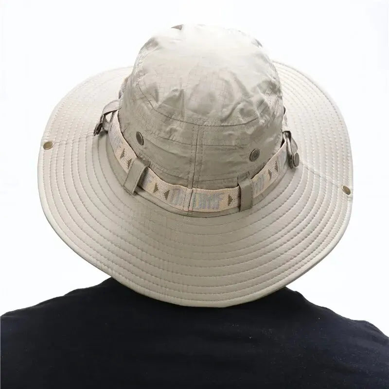 Beige wide-brimmed hat with camouflage band on a white background