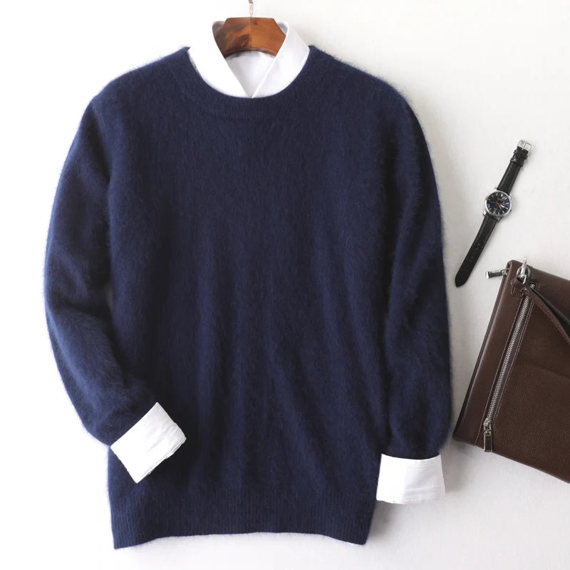 Navy sweater with white shirt collar on a hanger, next to a watch and brown bag on a white background