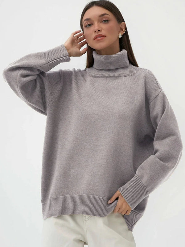 Woman wearing a gray turtleneck sweater on a white background with 'Bornladies' branding.