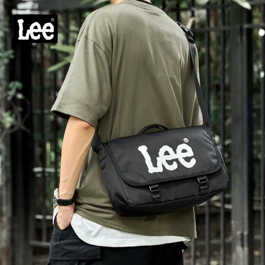 Person wearing a green shirt with a black 'Lee' bag over one shoulder, with 'Lee' branding visible.