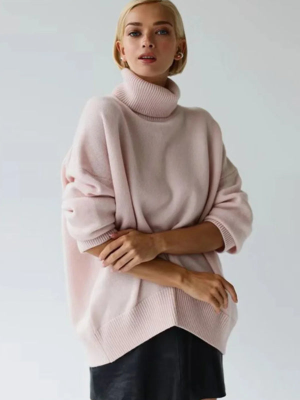 Woman wearing a pink sweater and black skirt with 'Bornladies' branding.
