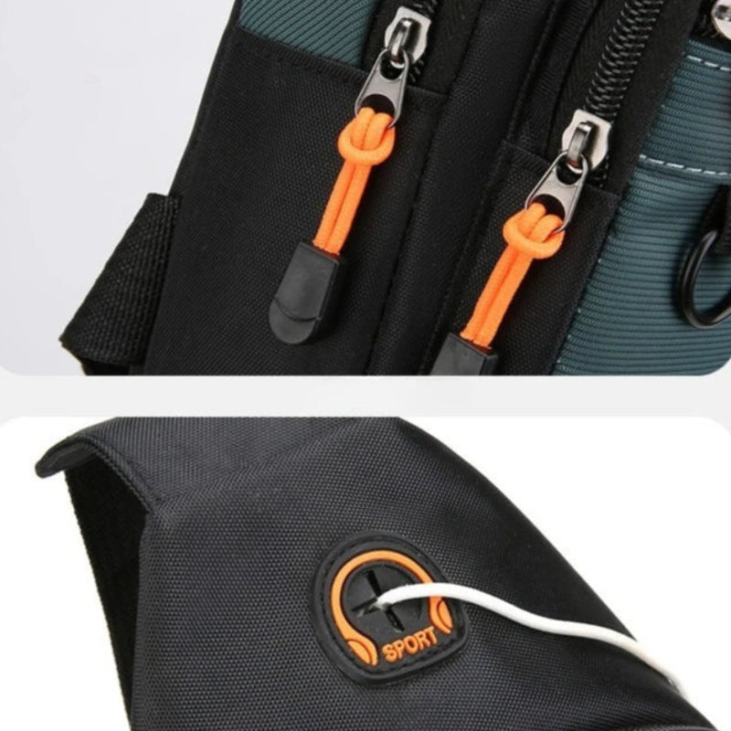 Close-up of a black bag with orange zippers and a Sport logo.