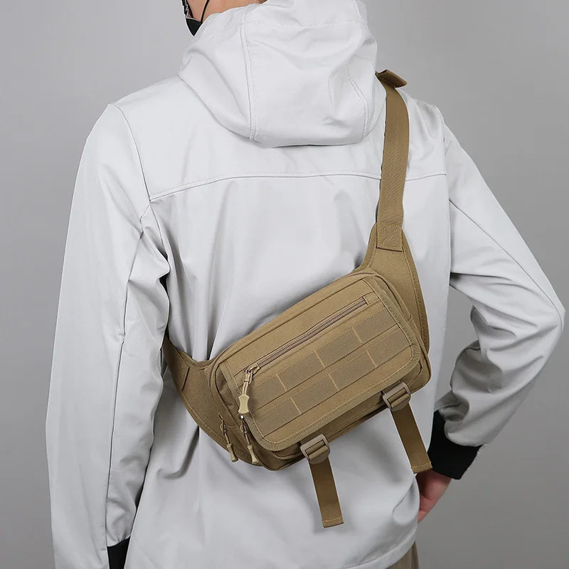 Person wearing a beige tactical sling bag over a gray background