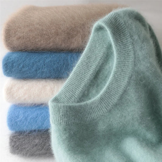Stack of folded light blue, gray, and beige socks on a white background