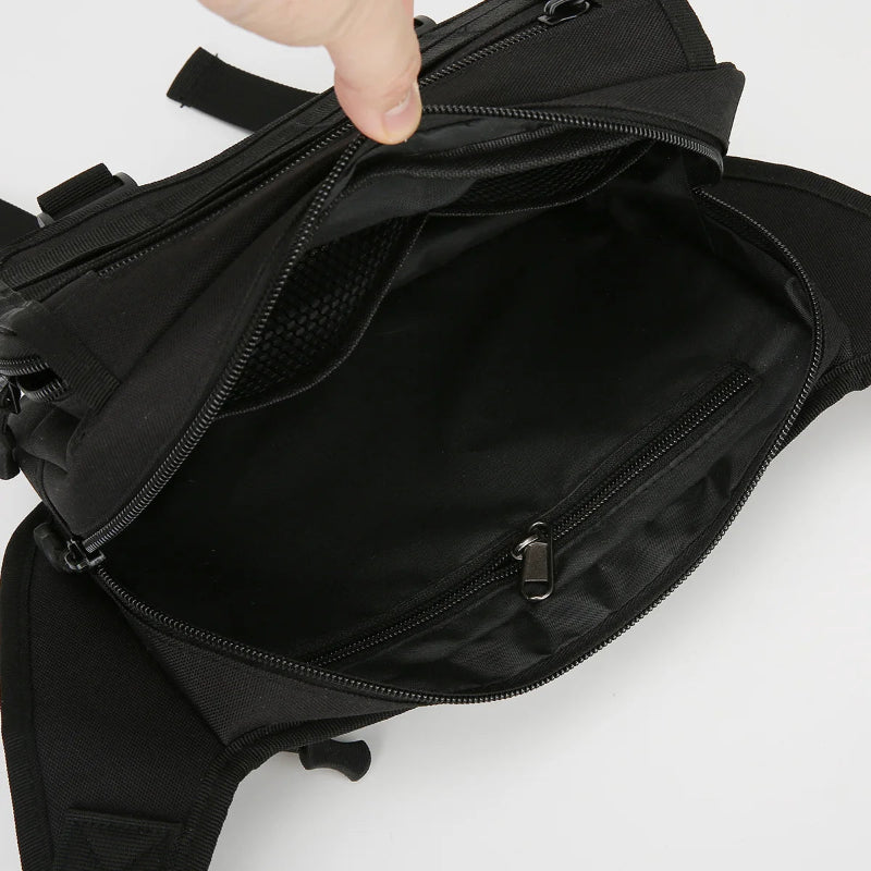 Black backpack with a hand opening the zipper on a white background