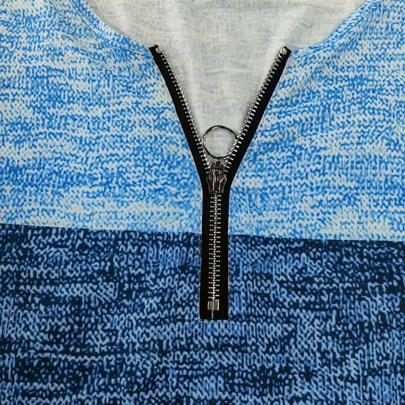 Blue and gray patterned fabric with a zipper running vertically through it.