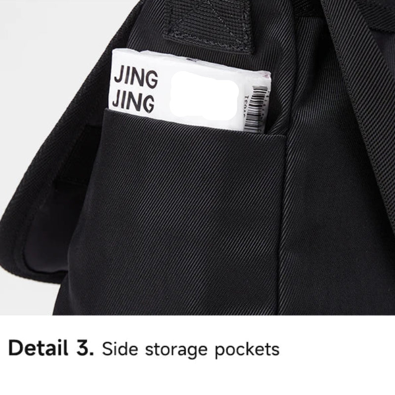 Black jacket with a side storage pocket featuring a 'JING JING' label.